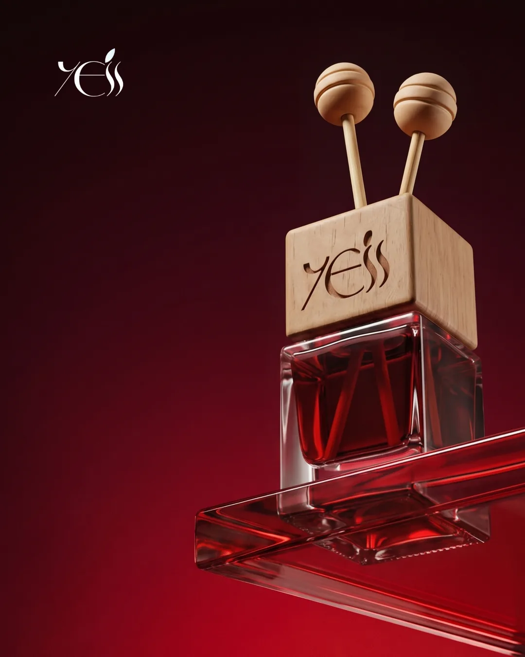 3D render of the Yess Cosmetic reed diffuser, an engraved wooden cap over red fragrance on a glass shelf against deep crimson